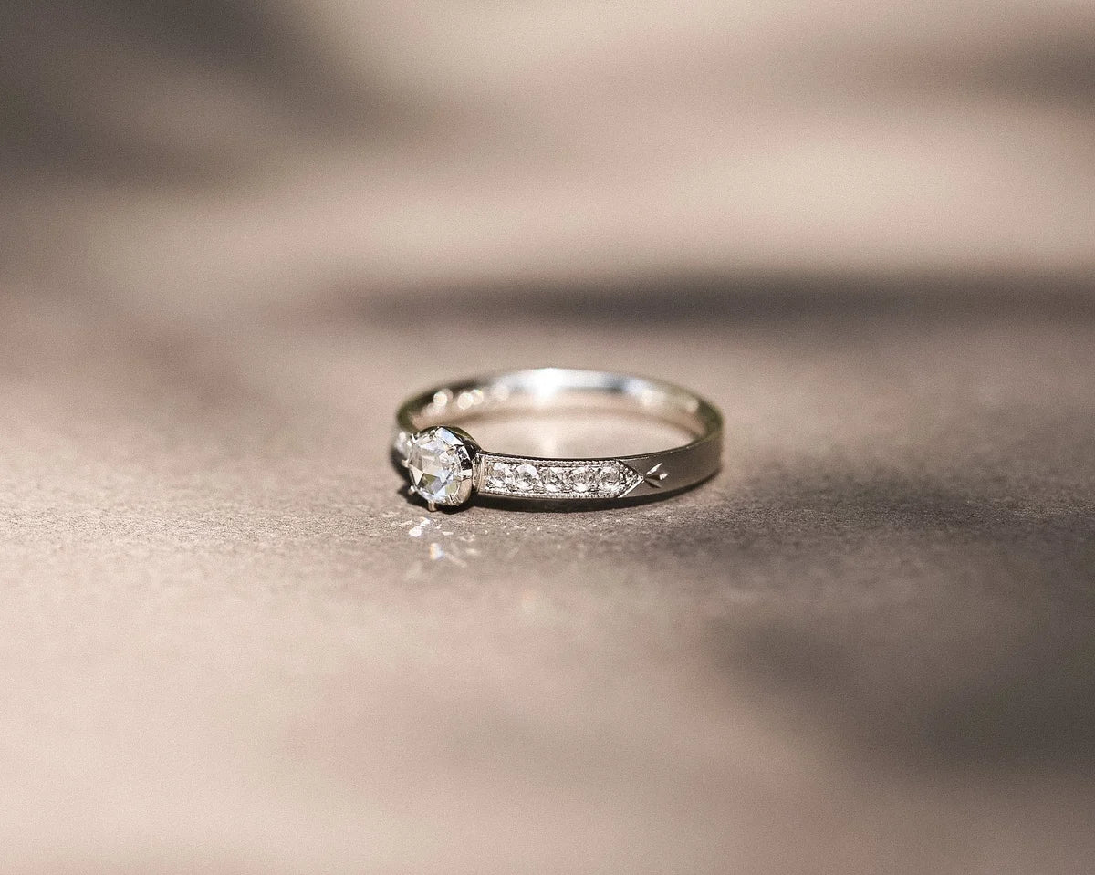 Fine platinum ring with rose-cut diamond and milgrain detail