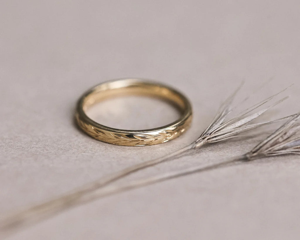 Inside view of 18ct yellow gold wedding ring with hallmark