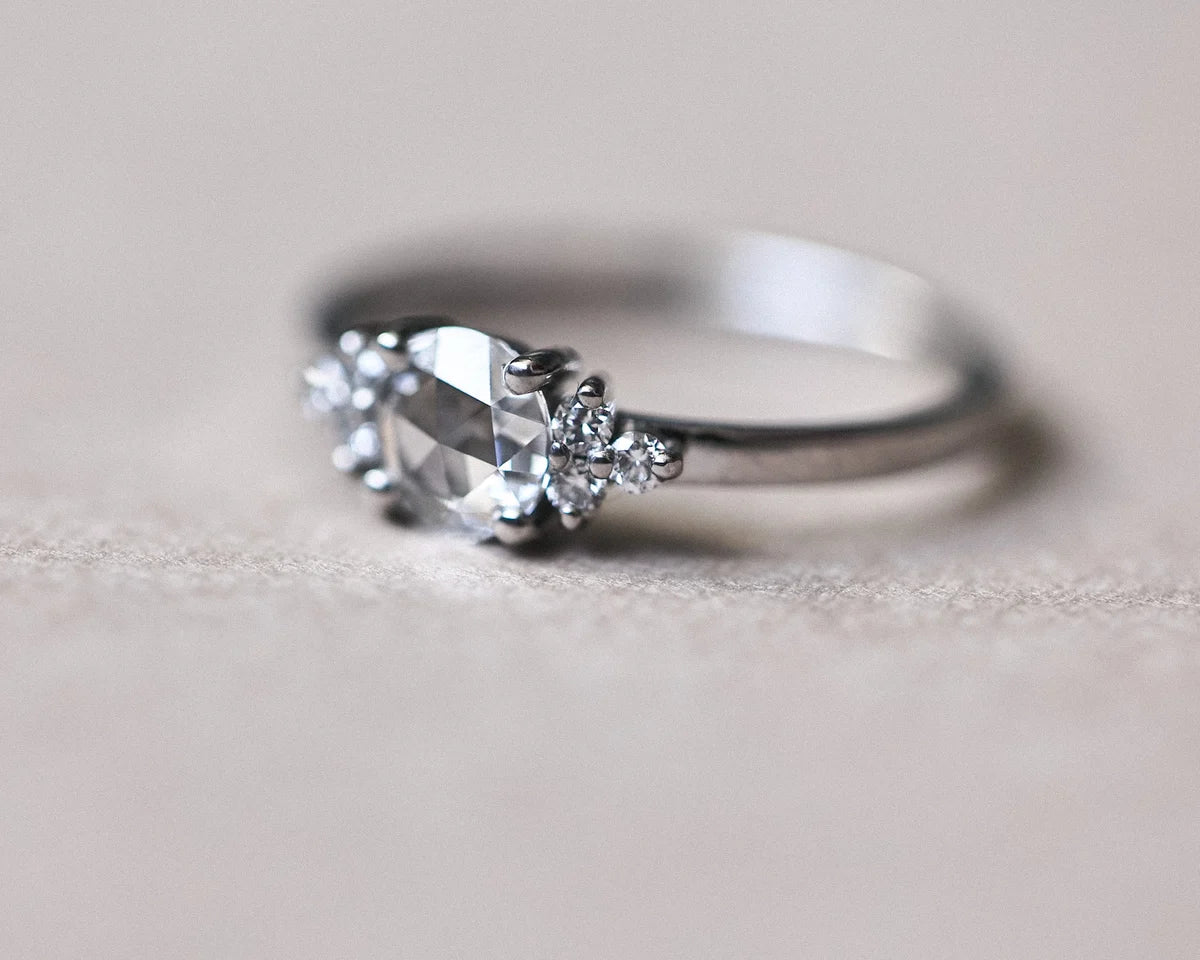 Profile view of platinum diamond ring with 5mm rose-cut centre stone