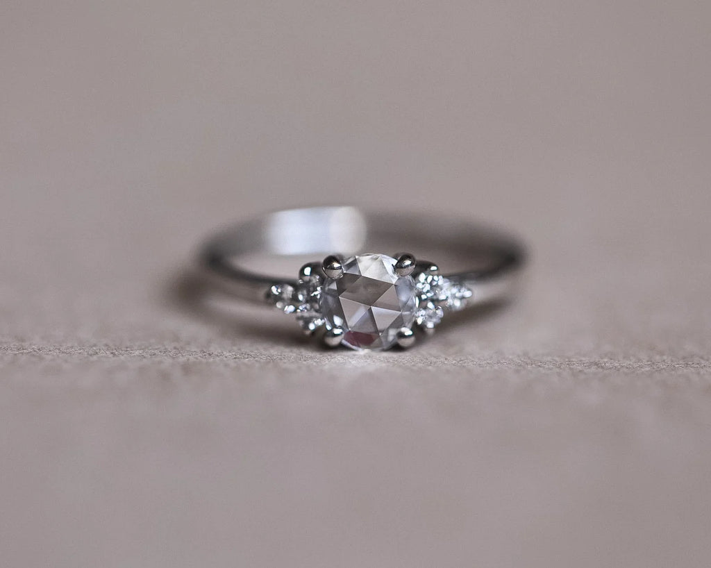 Back profile of platinum rose-cut diamond ring showing shoulder stones