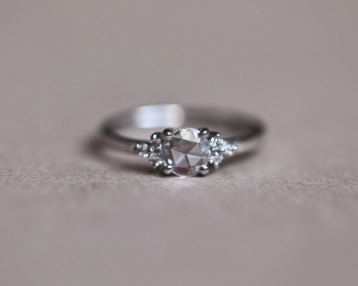 Back profile of platinum rose-cut diamond ring showing shoulder stones