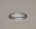 2mm olive leaf and milled edge flat court wedding ring in platinum