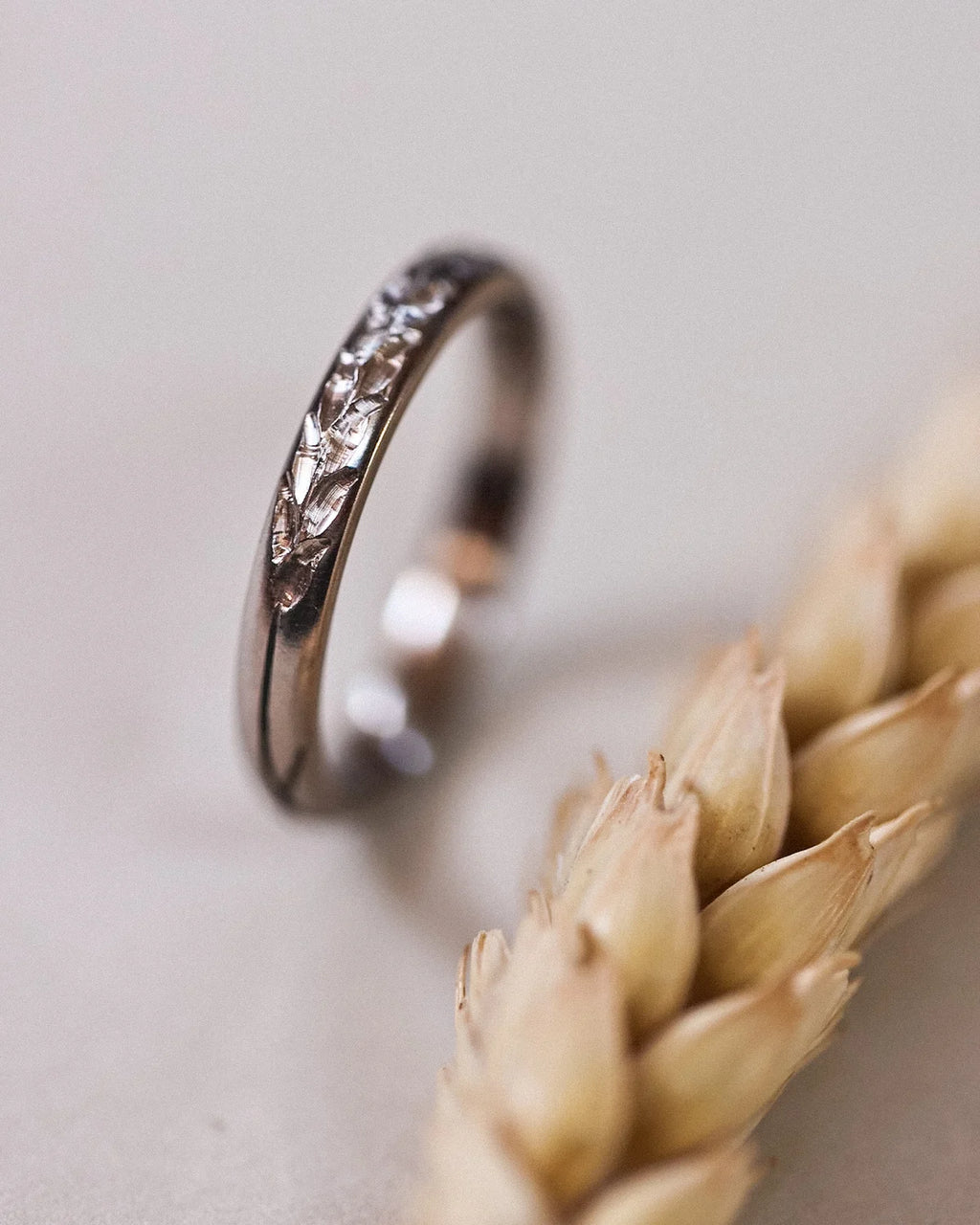 Side view of 18ct white gold Barleycorn engraved wedding ring