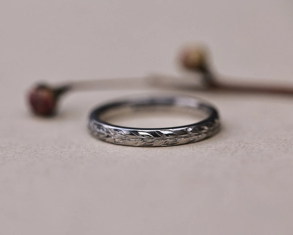Low front view of handmade platinum olive leaf wedding band