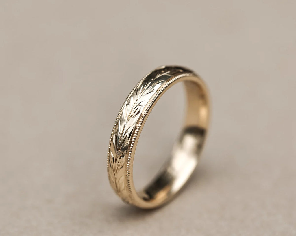 Side profile of 9ct yellow gold olive leaf engraved wedding band