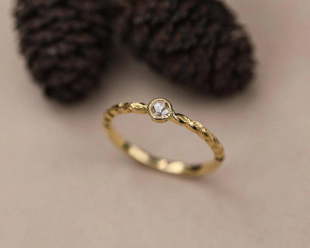 Angled view of 18ct yellow gold laurel leaf diamond ring
