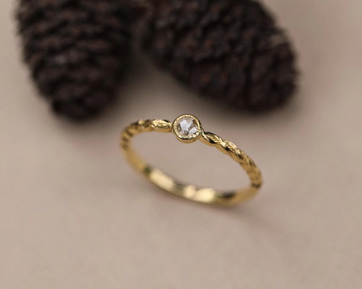 Angled view of 18ct yellow gold laurel leaf diamond ring