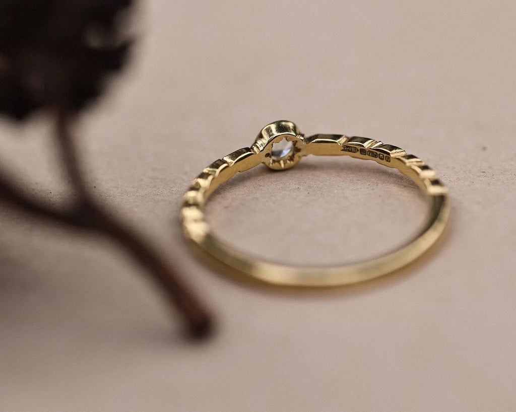 Back view of 18ct yellow gold ring showing carved laurel leaf detail
