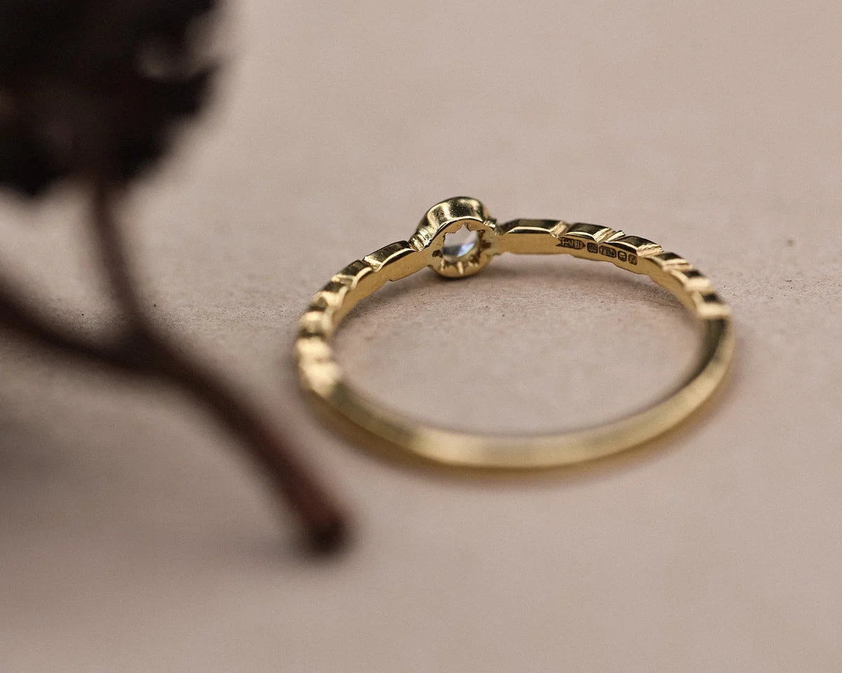 Back view of 18ct yellow gold ring showing carved laurel leaf detail