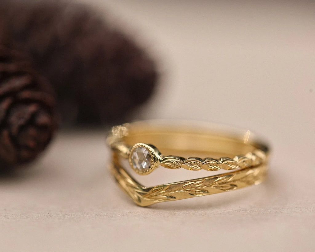 Rose-cut diamond laurel ring paired with curved wishbone wedding band