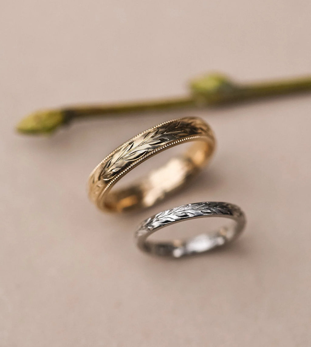 Platinum olive leaf engraved ring paired with yellow gold wedding band