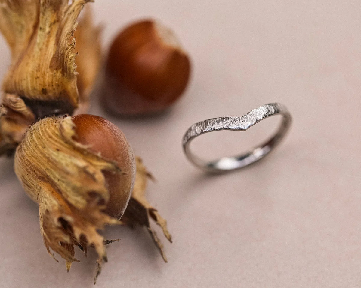 Platinum horn texture wishbone ring styled with hazelnuts and dried flowers