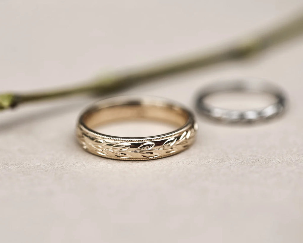 9ct yellow gold olive leaf ring shown with white gold wedding band