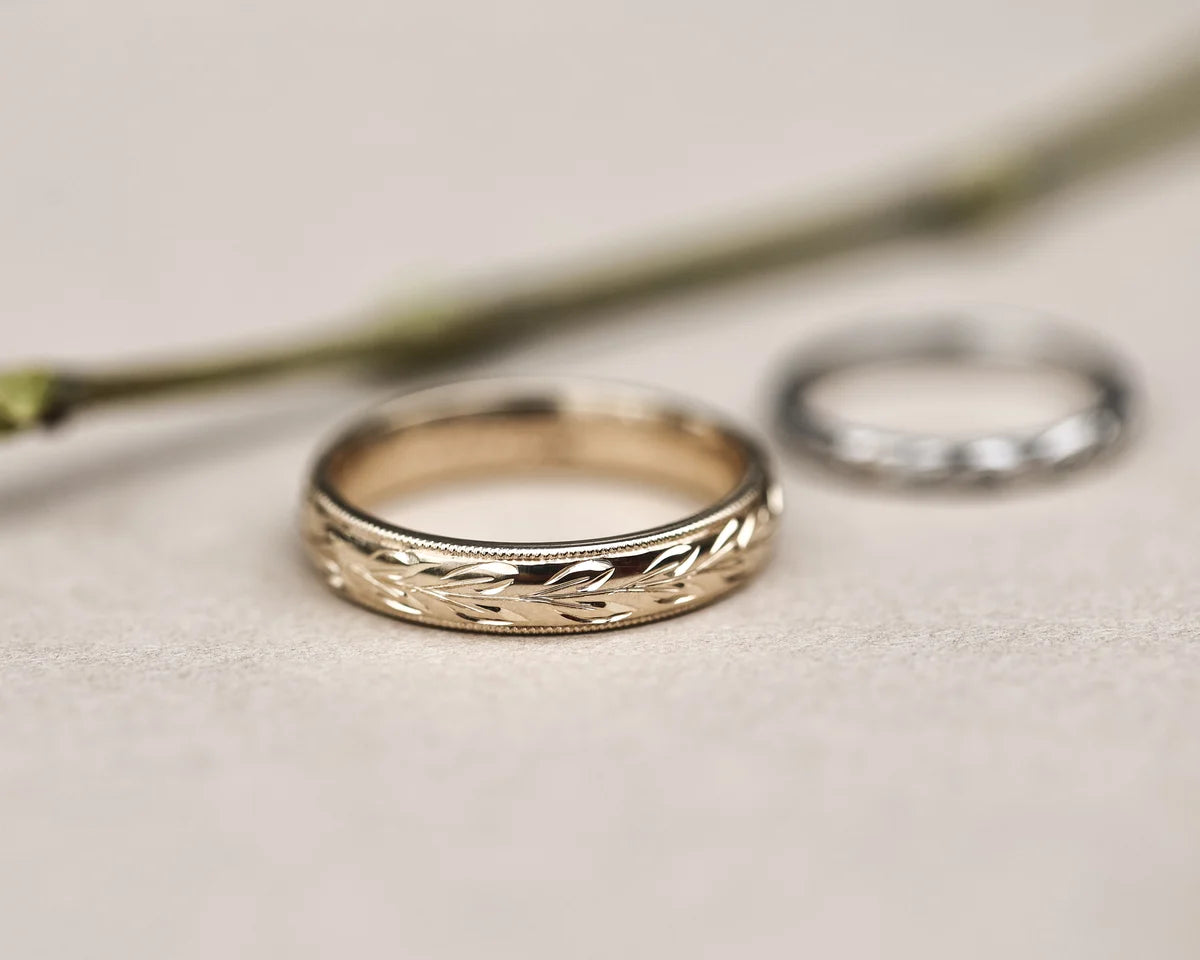 9ct yellow gold olive leaf ring shown with white gold wedding band