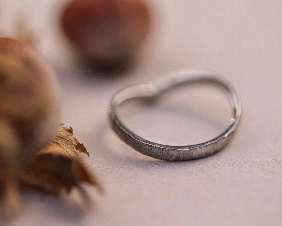 Low front view of 2mm horn texture wishbone ring in platinum
