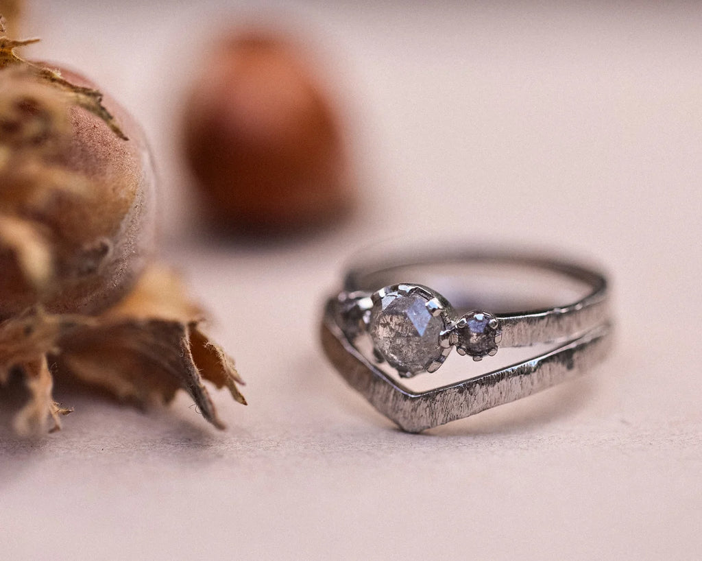 Platinum horn texture wishbone ring stacked with rose-cut diamond ring