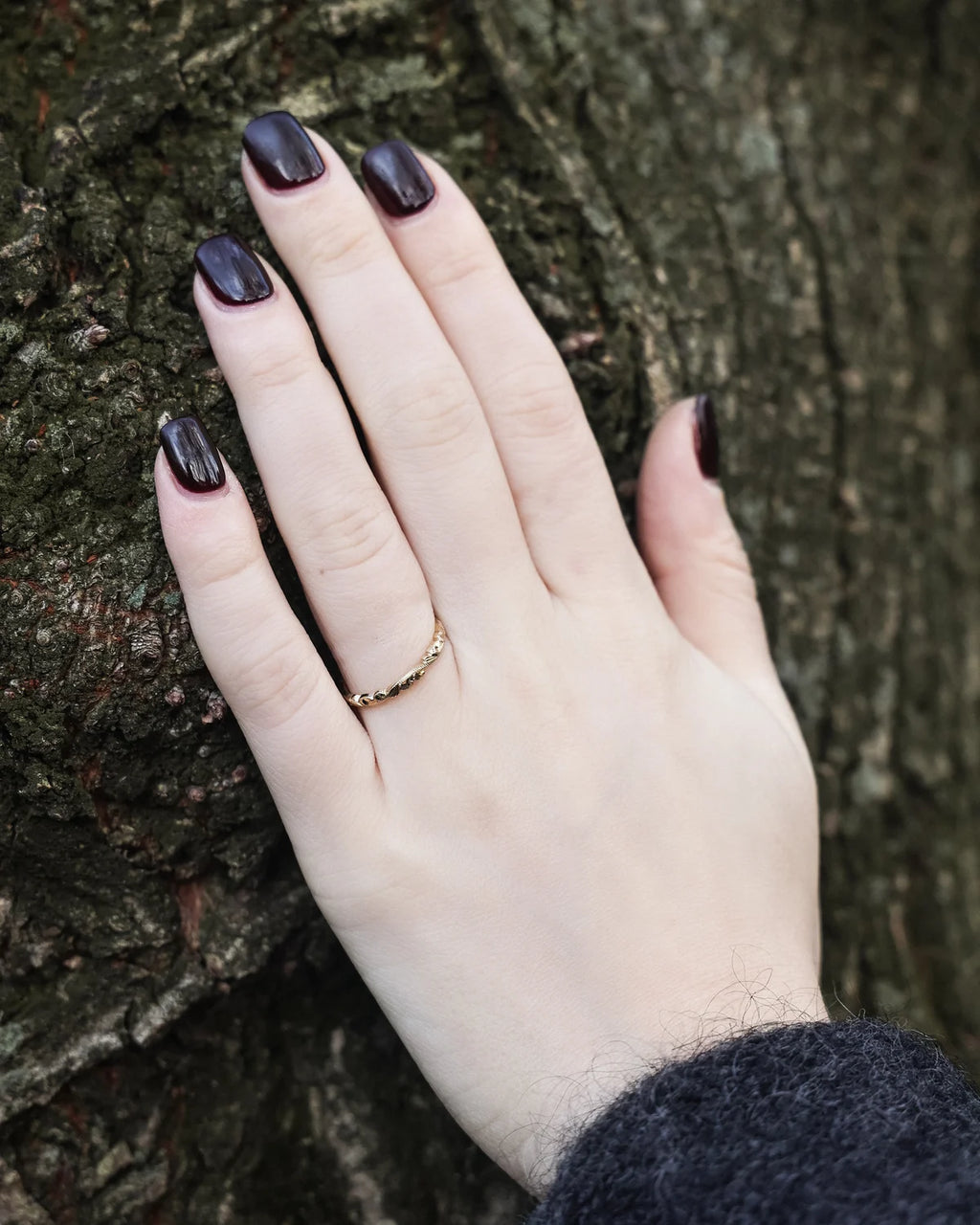 gold wedding ring worn on hand 18ct engraved band
