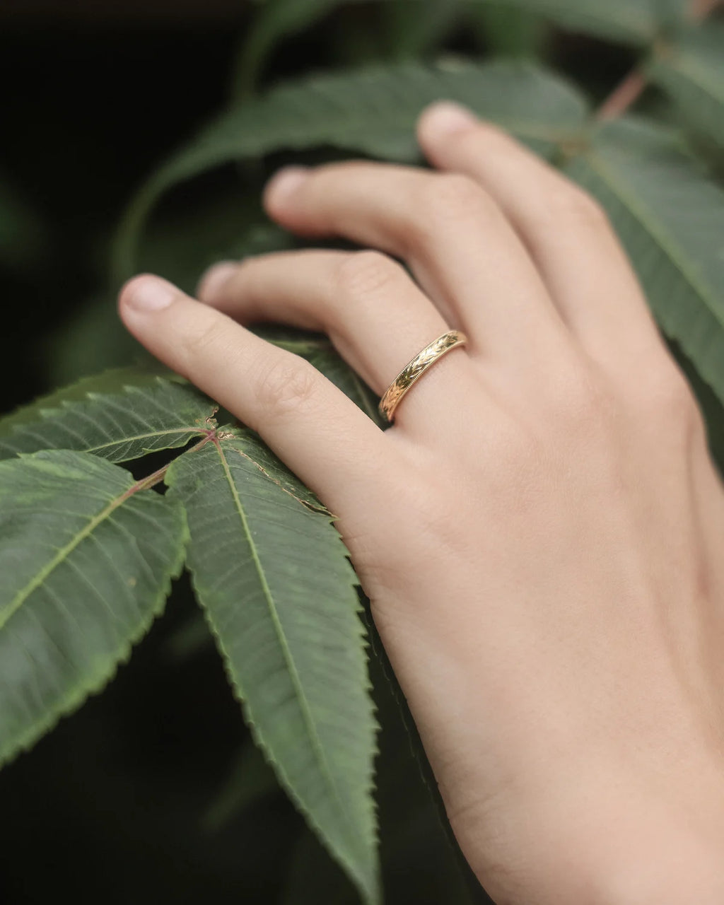 gold wedding ring worn on hand olive leaf engraved band 2.5mm
