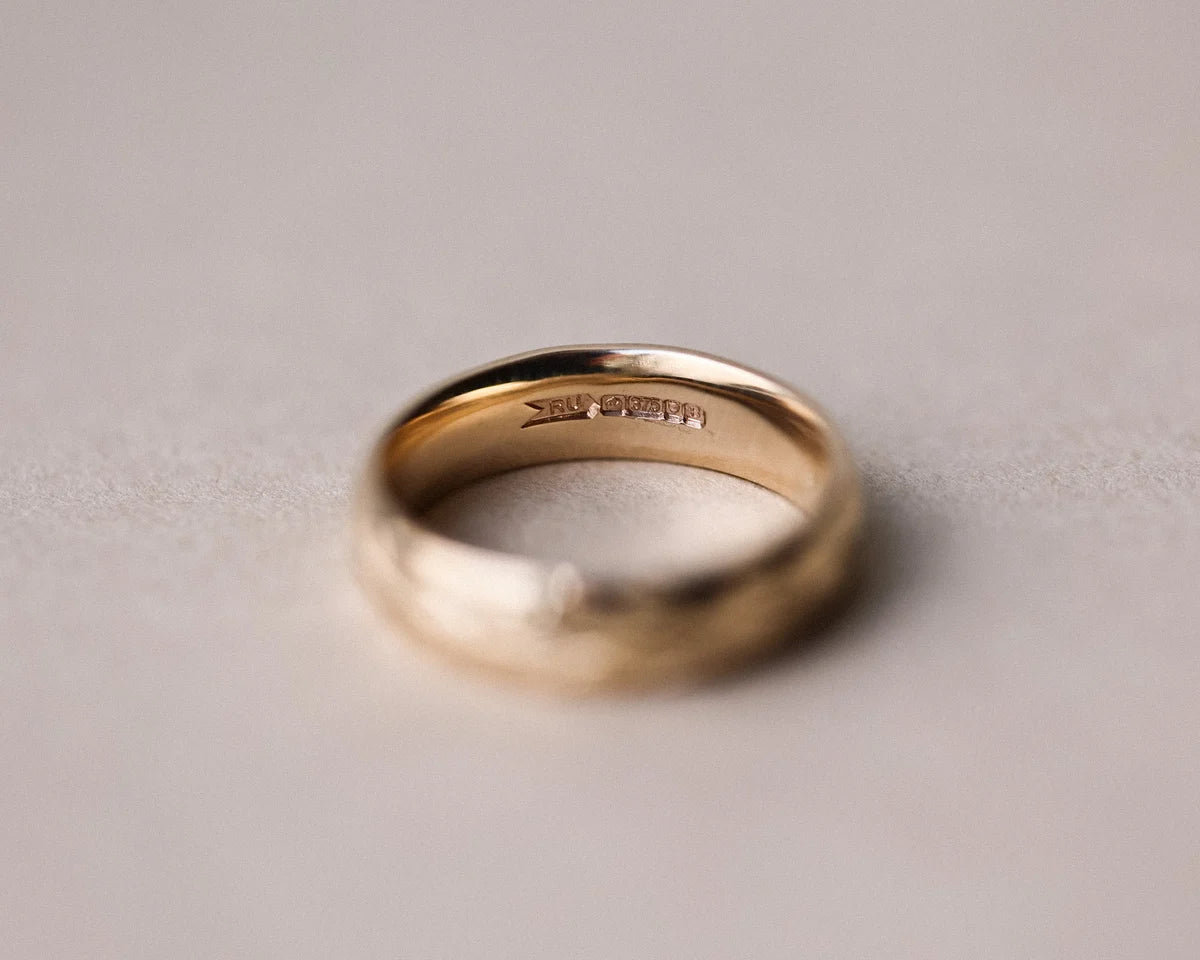 Back view of court shaped wedding ring in 9ct yellow gold