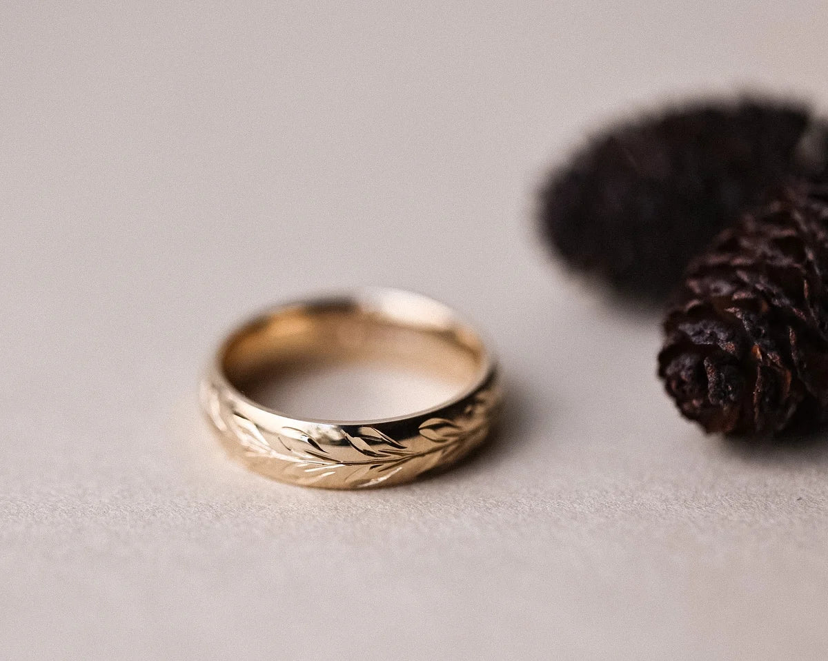 Olive leaf engraved court ring in 9ct yellow gold with natural styling