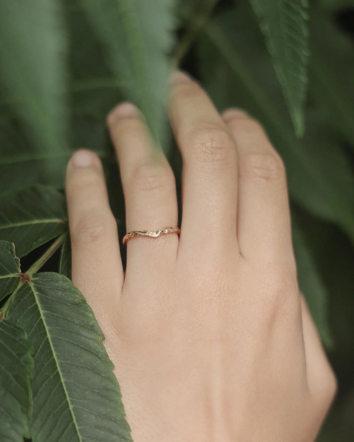 wishbone wedding ring worn with engagement ring 18ct rose gold