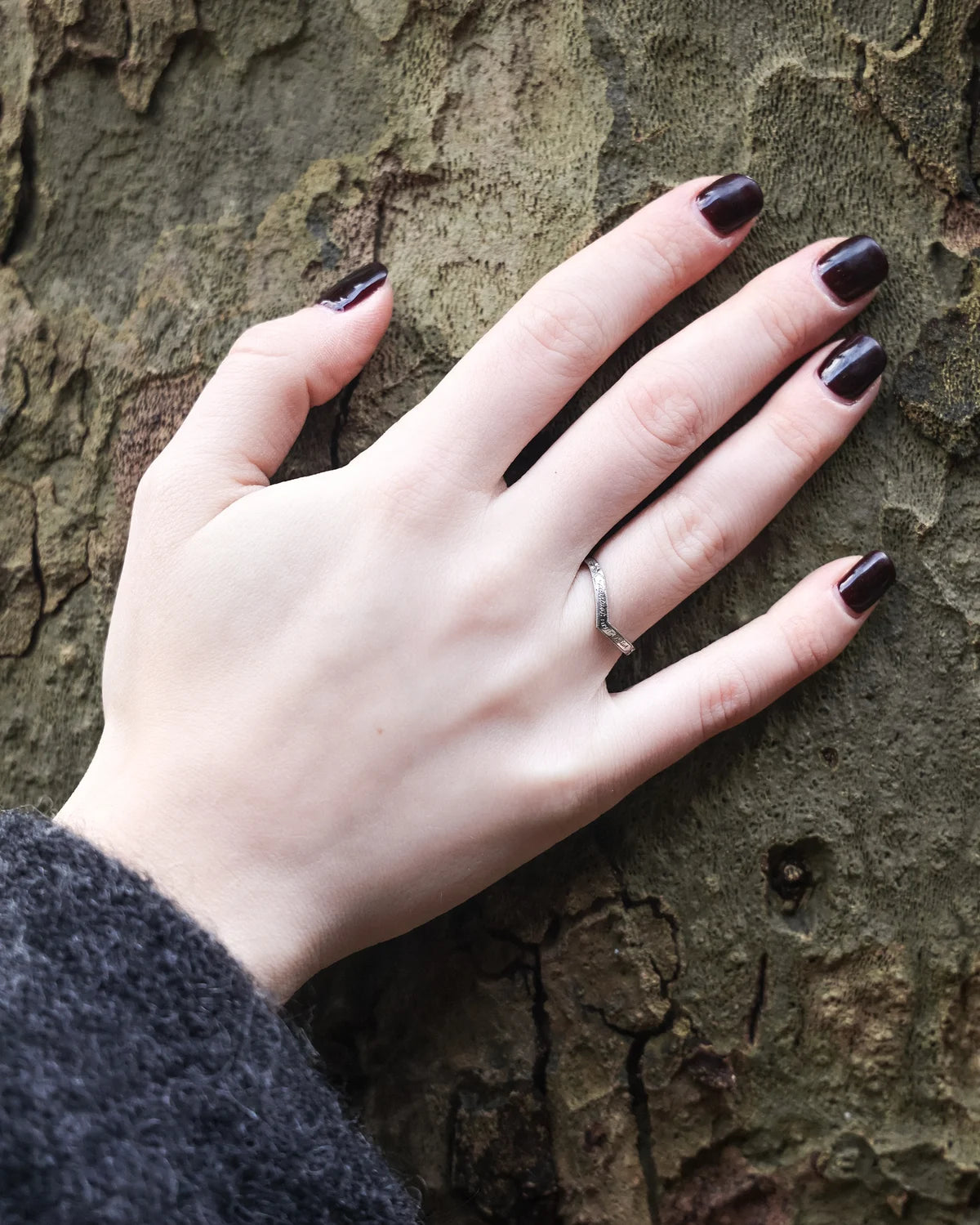 wishbone wedding ring worn with engagement ring platinum band