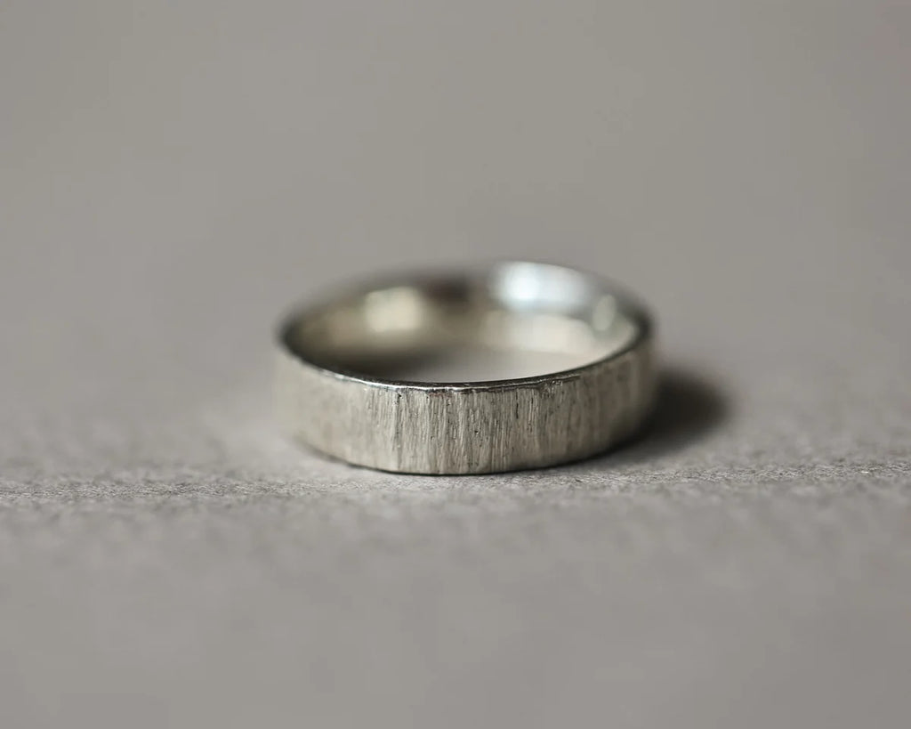 Low front view of handmade 9ct white gold horn texture ring