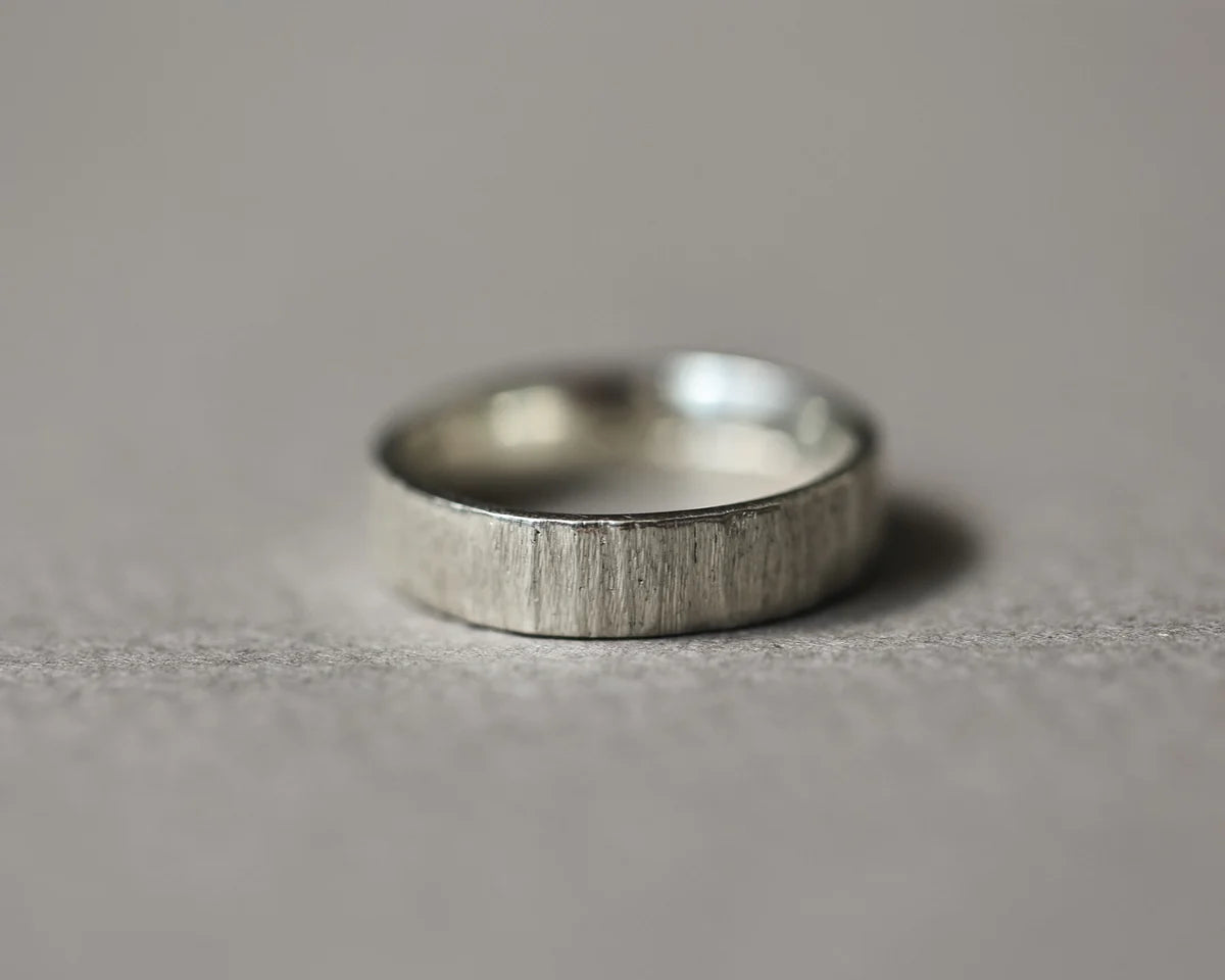 Low front view of handmade 9ct white gold horn texture ring