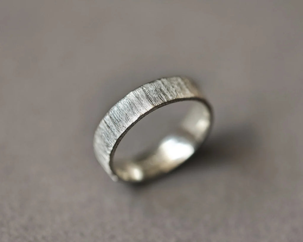 Angled view of handmade horn texture ring in white gold
