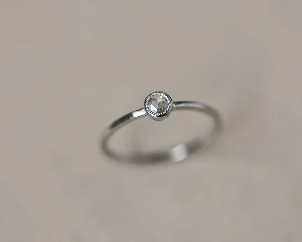 milled edge beaded setting detail platinum diamond ring
