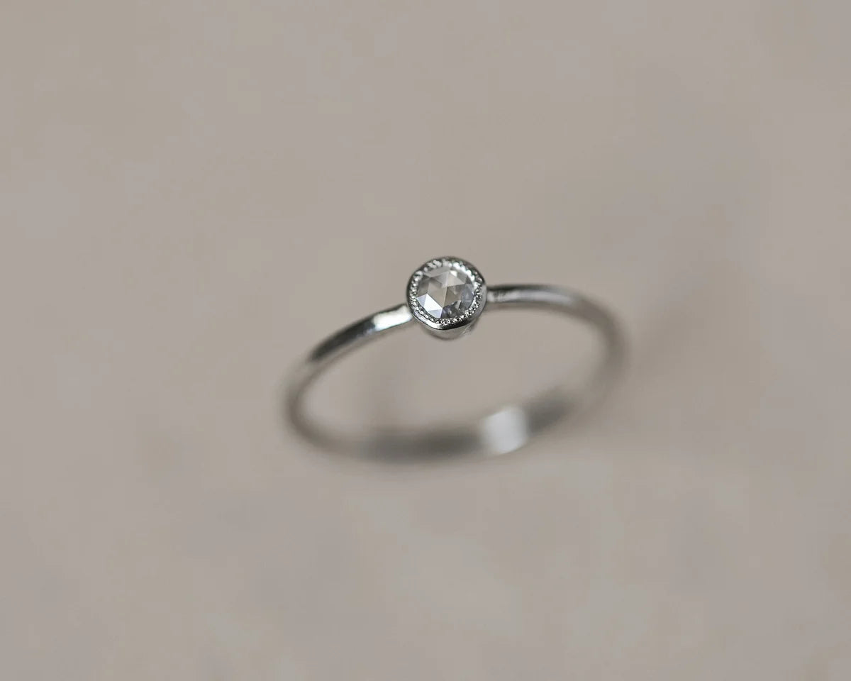 milled edge beaded setting detail platinum diamond ring
