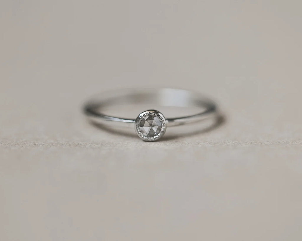 milled edge beaded setting detail platinum diamond ring