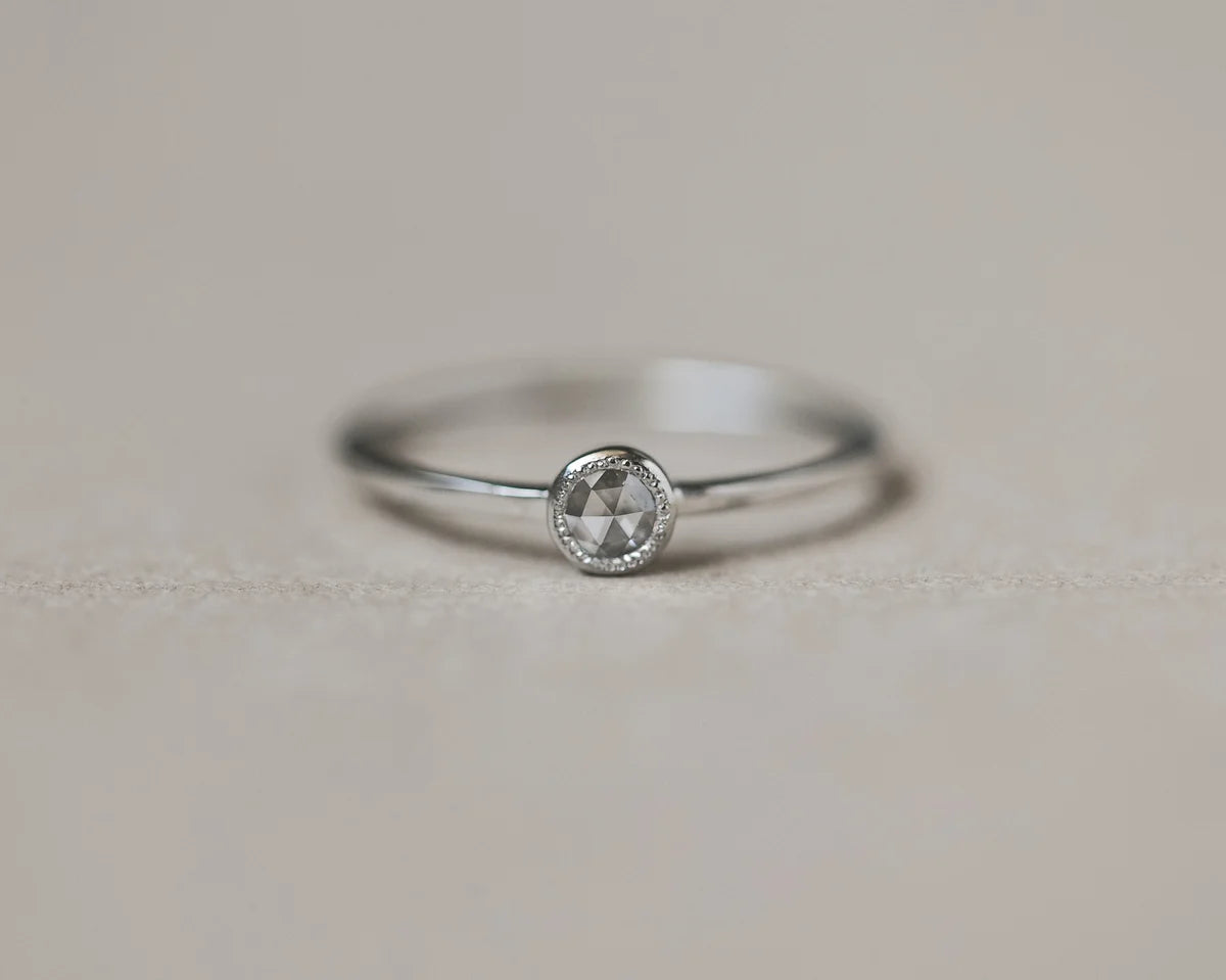 milled edge beaded setting detail platinum diamond ring
