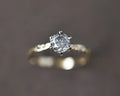 Angled view of 18ct yellow gold salt and pepper diamond ring