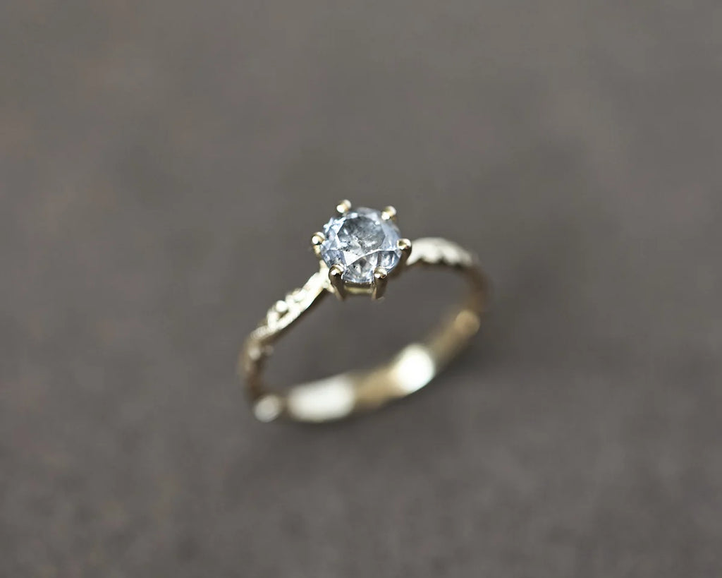 Angled view of 18ct yellow gold salt and pepper diamond ring
