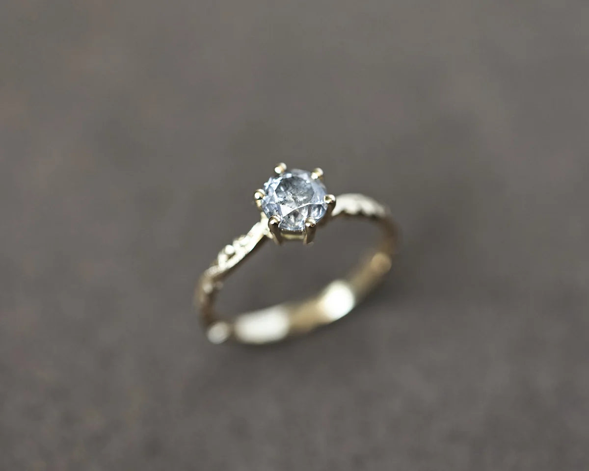 Angled view of 18ct yellow gold salt and pepper diamond ring