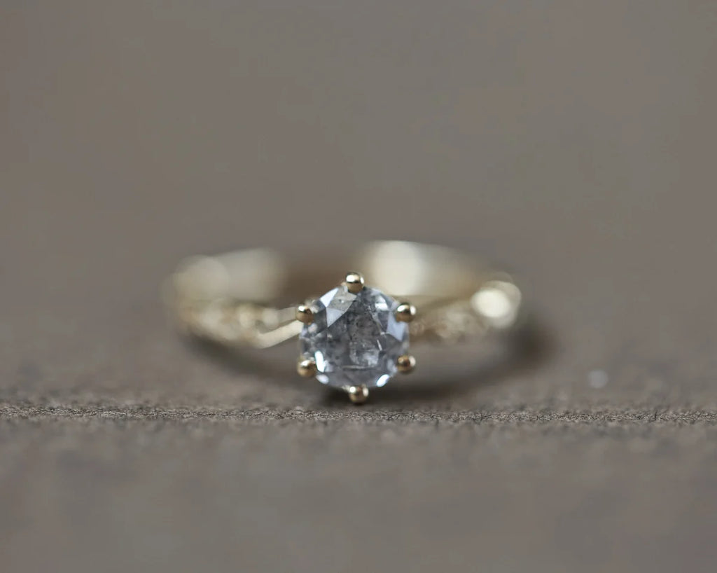 Low front view of grey diamond ring in 18ct yellow gold