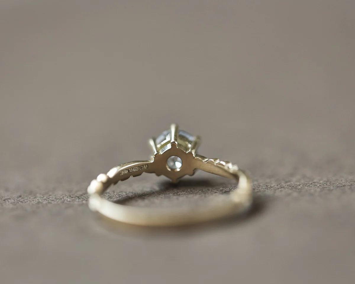 Back view of handmade yellow gold diamond ring with claw setting