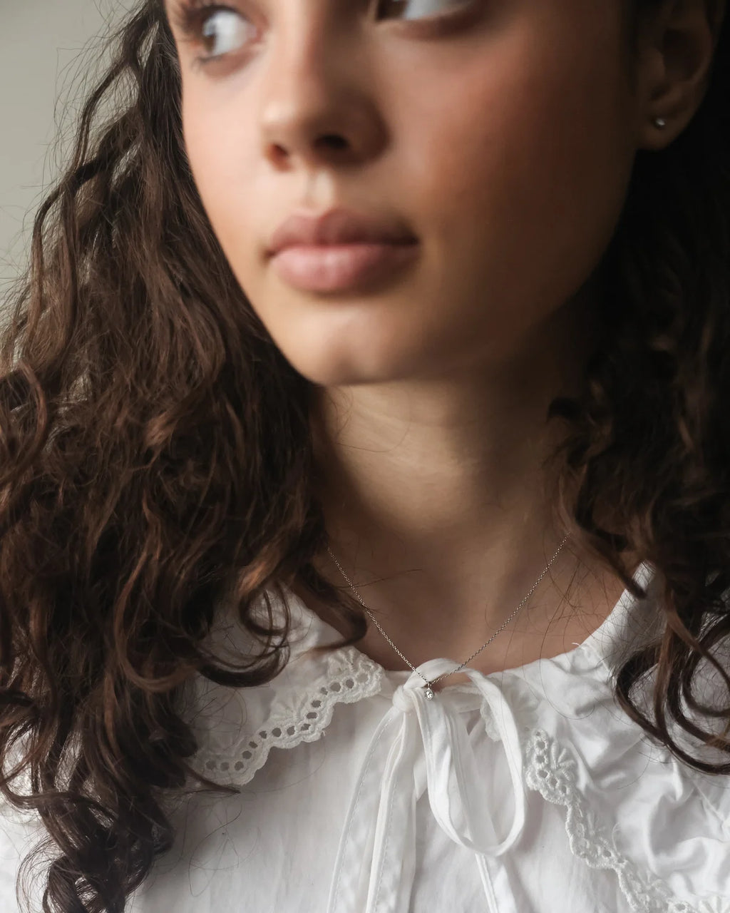 rose cut diamond necklace worn on neck platinum pendant