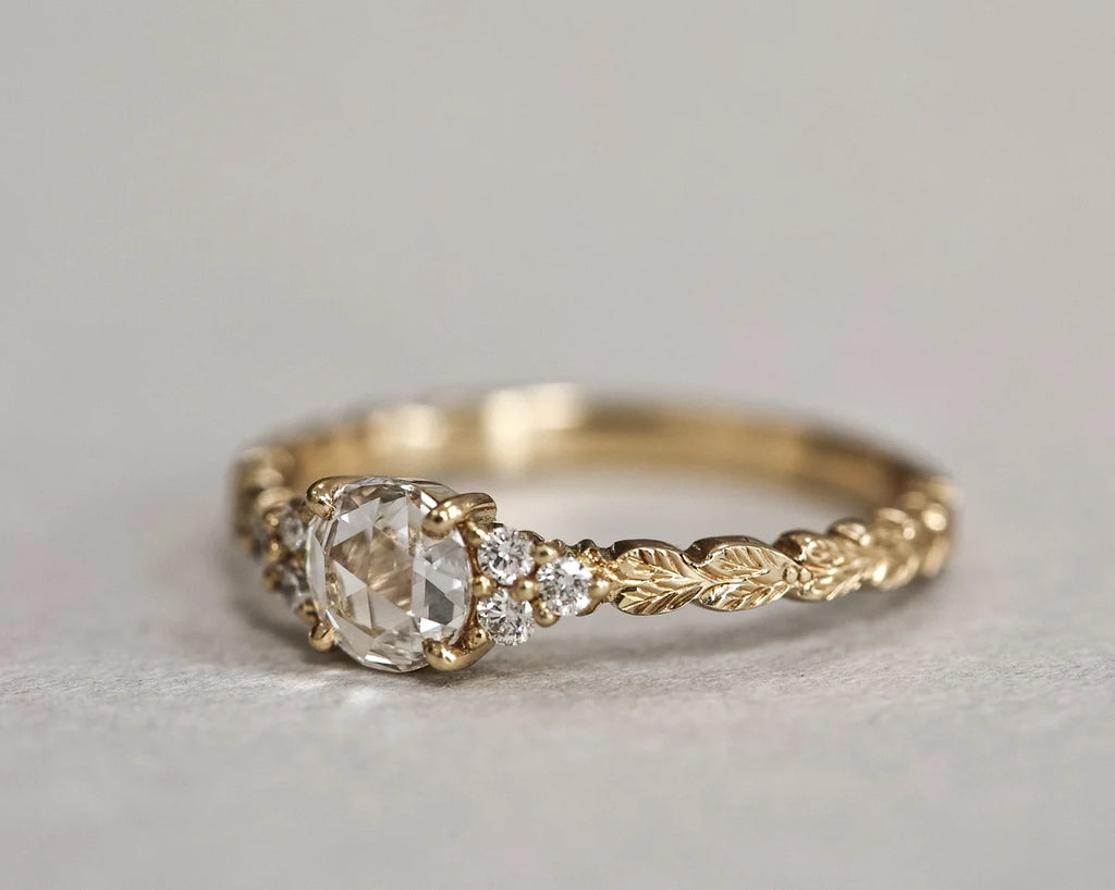 Front view of rose-cut diamond laurel leaf ring in yellow gold
