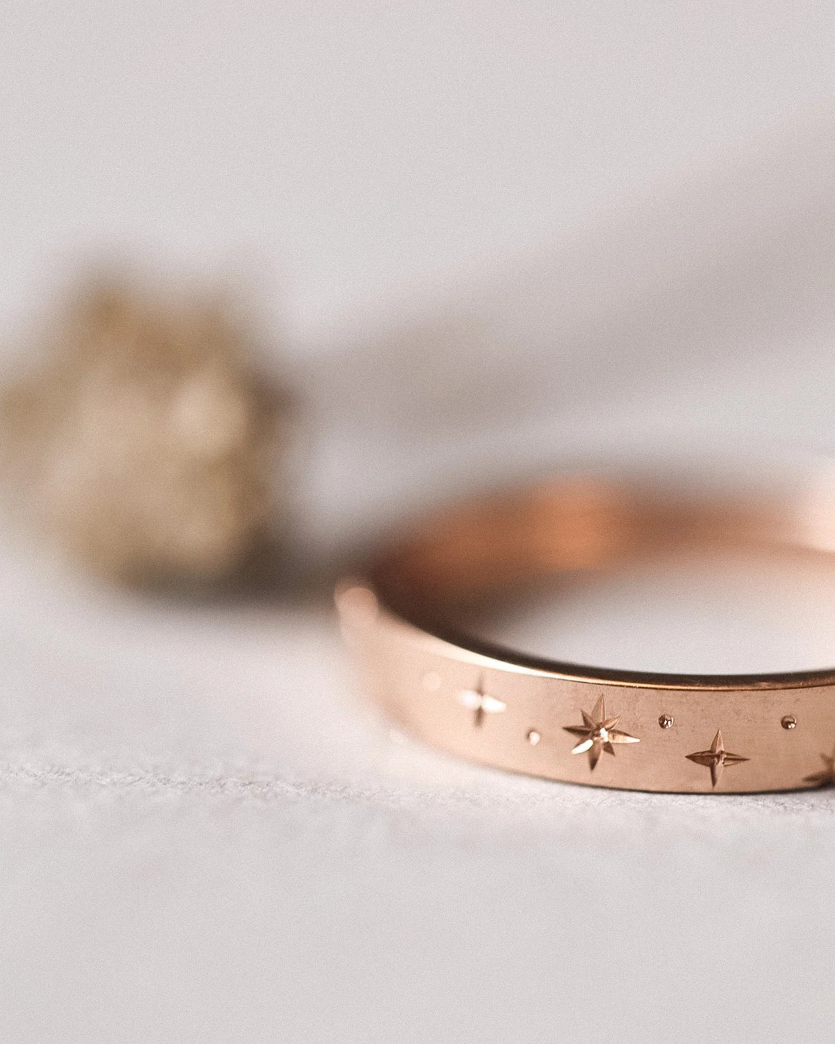 Side view of 3mm rose gold star eternity ring