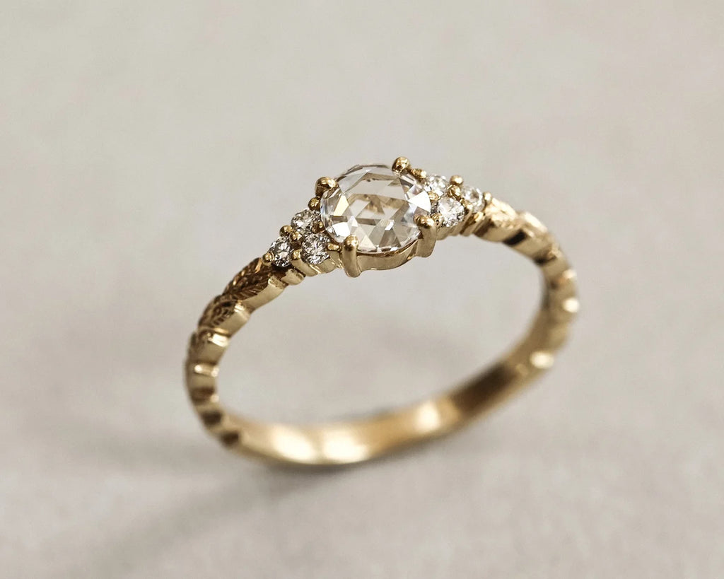 Detailed view of rose-cut diamond and brilliant-cut side diamonds