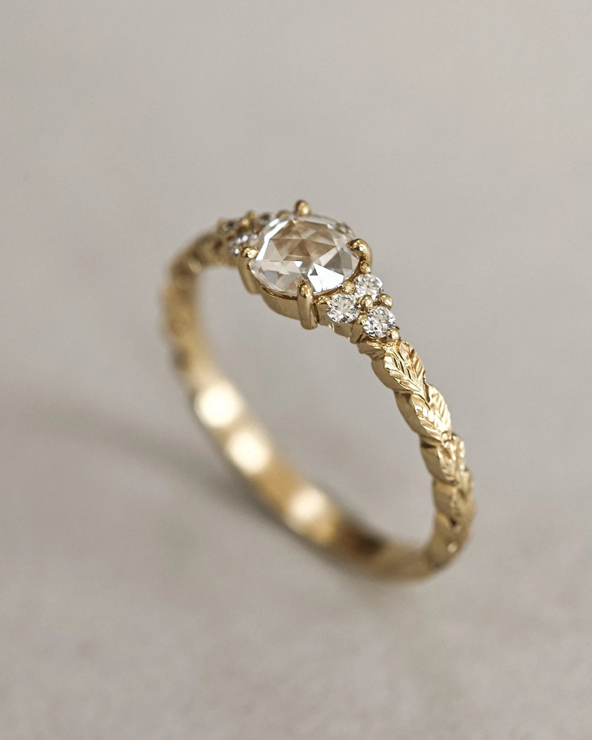 Side view of 18ct yellow gold laurel leaf engagement ring