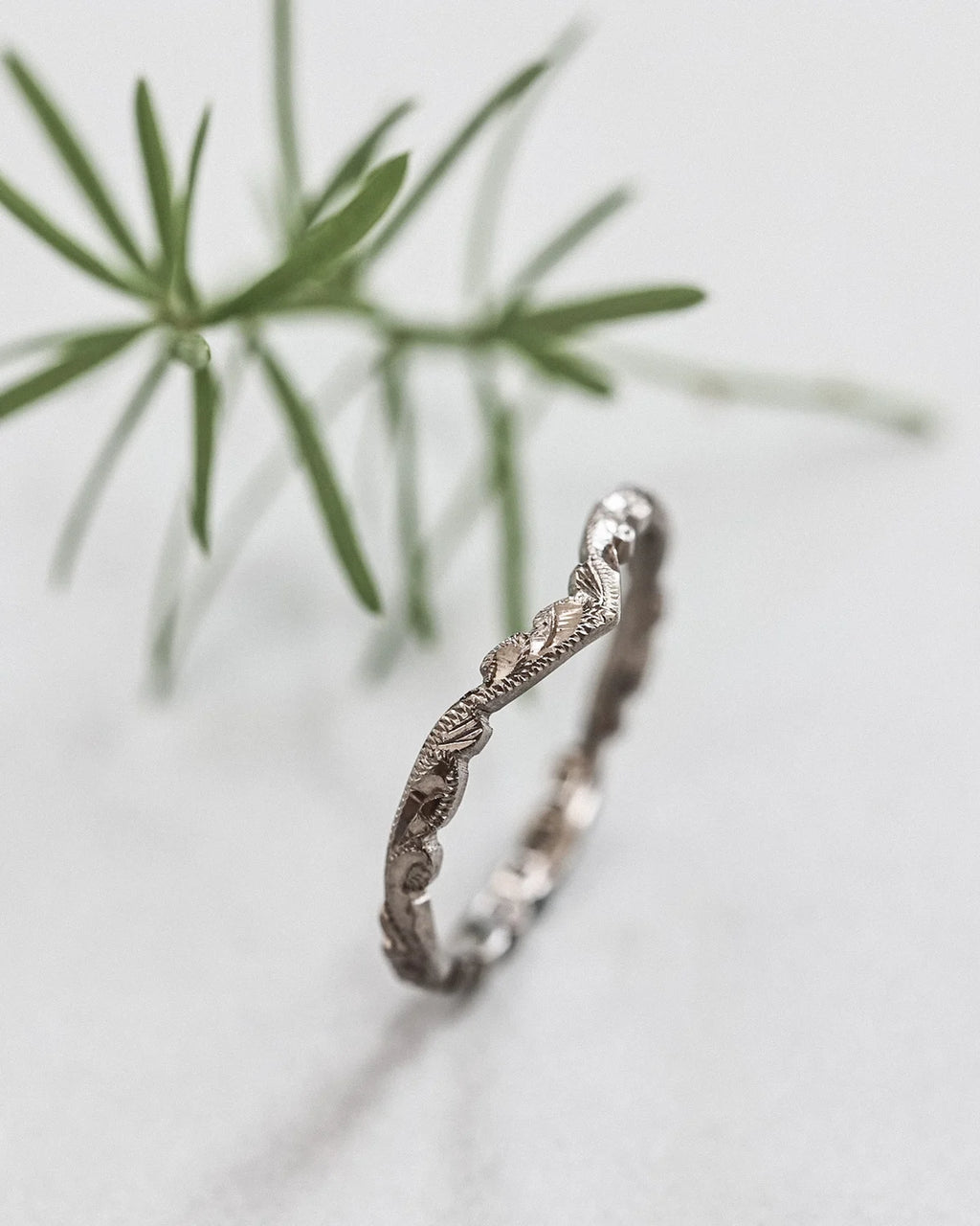 Engraved detail on wishbone V shape wedding ring