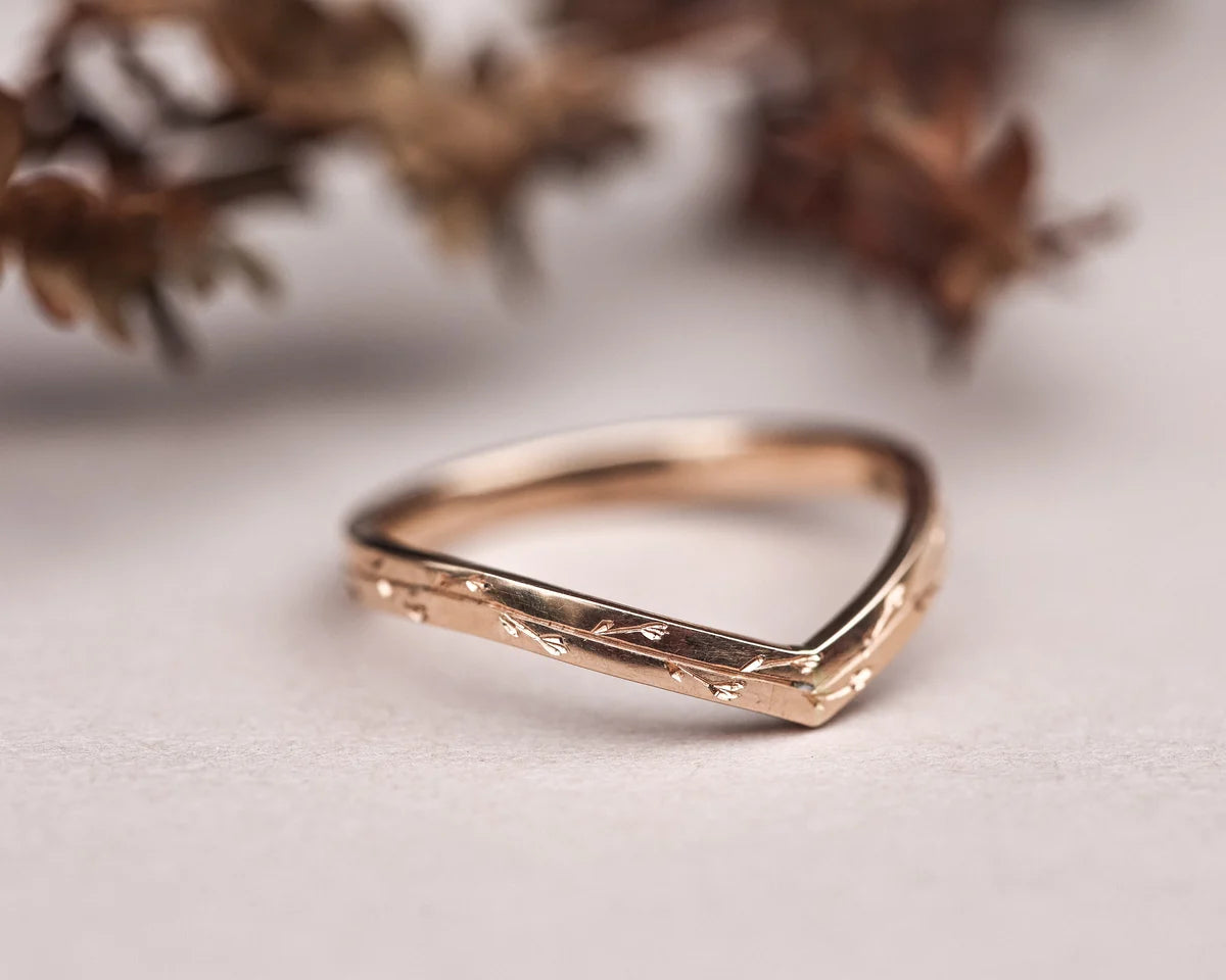 wishbone wedding ring worn with engagement ring 18ct rose gold