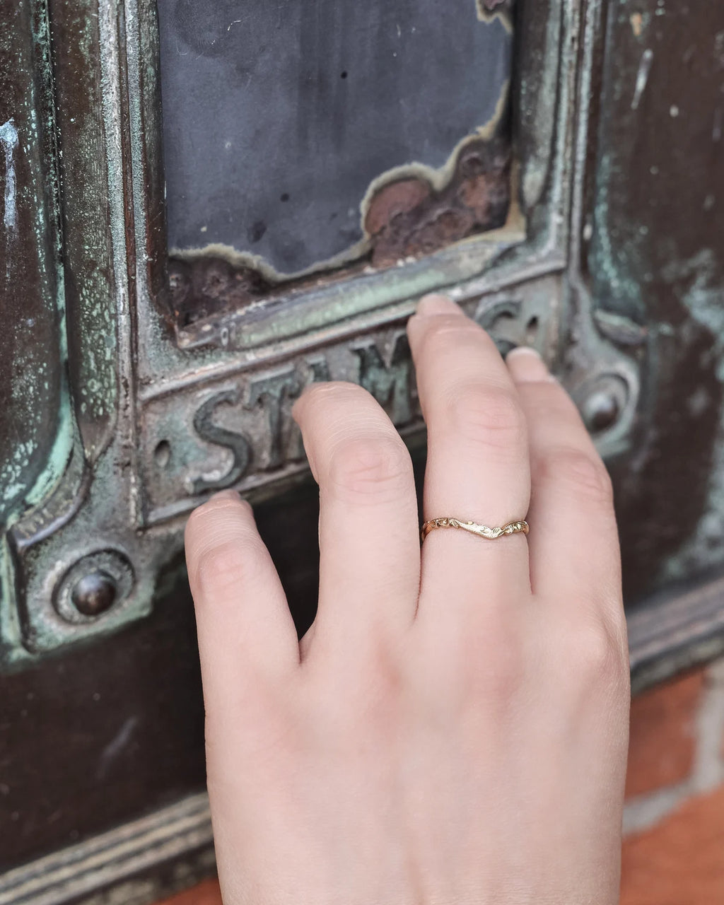 wishbone wedding ring worn with engagement ring 18ct gold