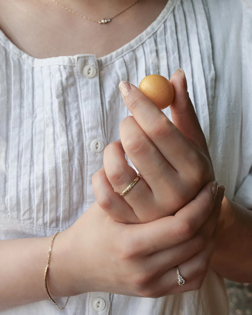 Lifestyle image of rose-cut diamond ring worn on hand