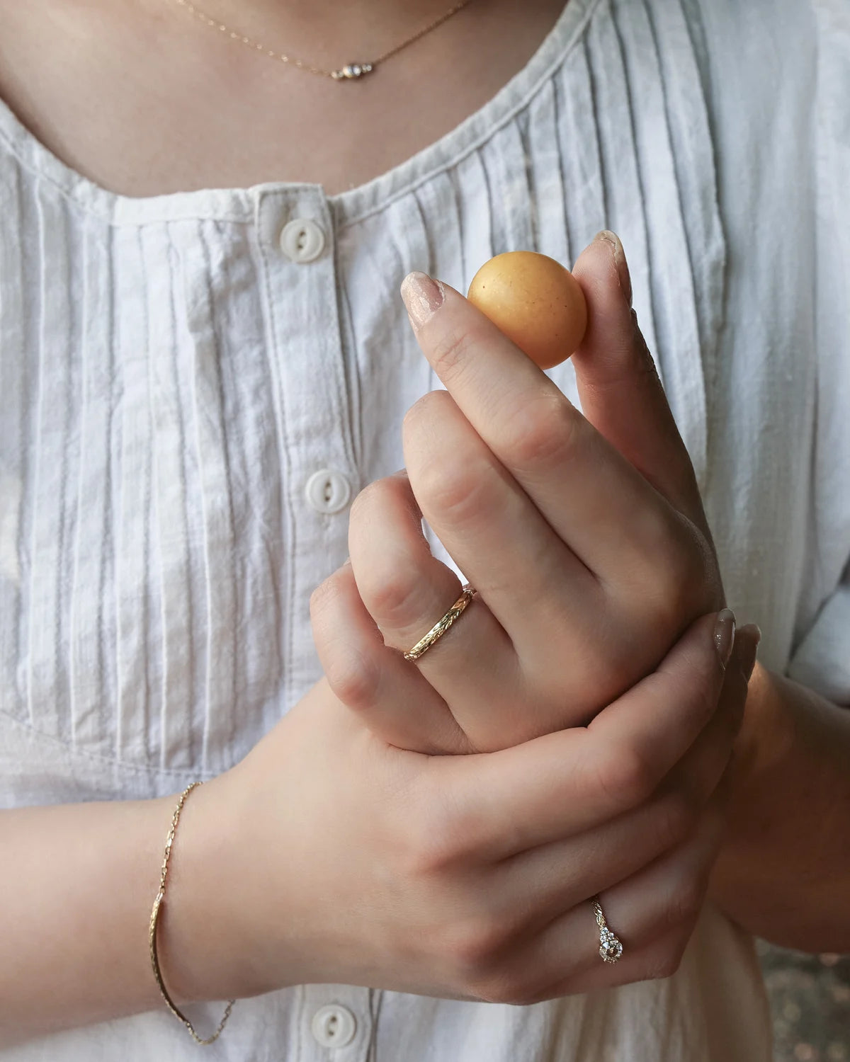 Lifestyle image of rose-cut diamond ring worn on hand