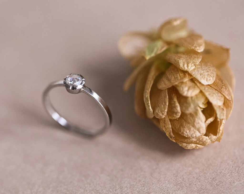 Angled view of handmade platinum rose-cut diamond ring