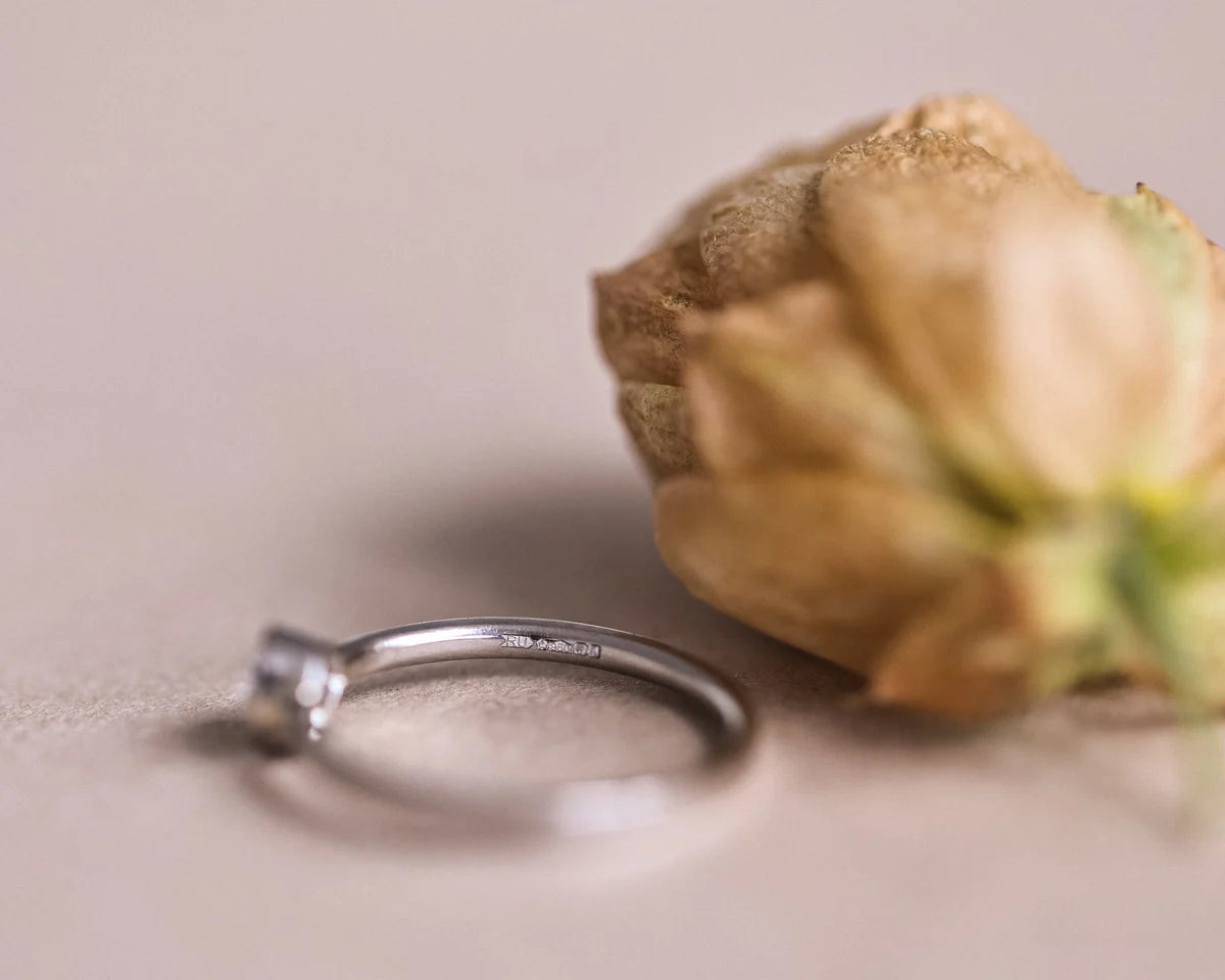 Side profile of handmade platinum ring with rose-cut diamond